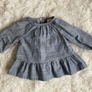 Blue baby blouse with snaps